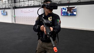 A police instructor from the Secretary of Citizen Security participates in a virtual reality training exercise