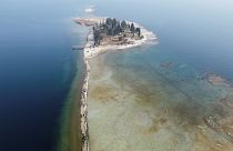 A drone image shows San Biagio island, affected by drought in Lake Garda, near Lido di Manerba, Italy.
