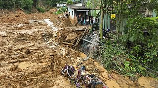 A crumpled vehicle lays in the mud after a deadly landslide triggered by heavy rains destroyed the area near Juquehy beach in the coastal city of Sao Sebastiao, Brazil