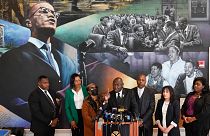Attorney Ben Crump, center, speaks during a news conference at the Malcolm X & Dr. Betty Shabazz Memorial and Educational Center in New York, Tuesday, Feb. 21, 2023. 