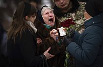 Nina Nikiforovа, 80, cries outside a church in Kyiv, Ukraine, on Feb. 11, 2023, at the funeral of her son Volodymyr, a Ukrainian serviceman killed in the east of the country.