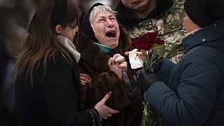 Nina Nikiforovа, 80, cries outside a church in Kyiv, Ukraine, on Feb. 11, 2023, at the funeral of her son Volodymyr, a Ukrainian serviceman killed in the east of the country.