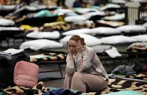 A Ukrainian woman in a gymnasium used as a refugee centre in Przemyśl, Poland on 8 March 2022