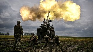  Ukrainian servicemen fire with a French self-propelled 155 mm/52-calibre gun Caesar towards Russian positions at a front line in the eastern Ukrainian region of Donbas..