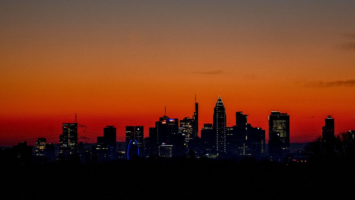 The sun is about to rise behind the buildings of the banking district in Frankfurt, Germany, Wednesday, March 9, 2022