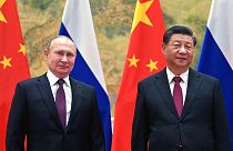 Chinese President Xi Jinping, right, and Russian President Vladimir Putin pose for a photo.