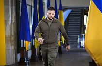 FILE - Ukrainian President Volodymyr Zelenskyy walks ahead of a press conference in a city subway under a central square in Kyiv, Ukraine, Saturday, April 23, 2022.