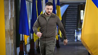 FILE - Ukrainian President Volodymyr Zelenskyy walks ahead of a press conference in a city subway under a central square in Kyiv, Ukraine, Saturday, April 23, 2022.