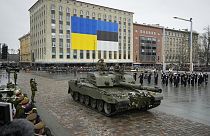 Tanks roll on Freedom Square at a military parade during celebrations of the 105th anniversary of the Republic of Estonia, in Tallinn, Estonia, Friday, Feb. 24