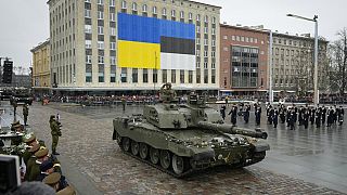 Tanks roll on Freedom Square at a military parade during celebrations of the 105th anniversary of the Republic of Estonia, in Tallinn, Estonia, Friday, Feb. 24