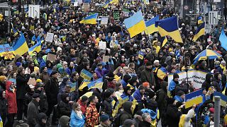 People attend a demonstration against Russia's war on Ukraine to mark the first anniversary of Russia's full-scale invasion of Ukraine, in Berlin, Germany, Friday, Feb. 24