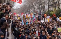 Protesters march during a rally in Paris, on Thursday 23 March.