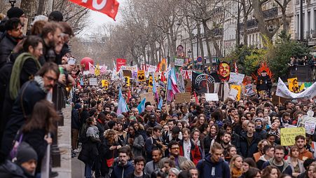 Protesters march during a rally in Paris, on Thursday 23 March.