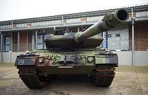 A Leopard 2 main battle tank is parking in front of a facility at the German forces Bundeswehr training area in Munster, Germany, Monday, Feb. 20, 2023. 