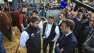 French President Emmanuel Macron meets famers as he visits the International Agriculture Fair during the opening day in Paris, Saturday, Feb. 25, 2023