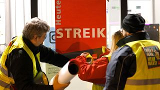 Strikers put a poster with the words 'Strike today' on a window pane in Cologne, Germany, 26 February 2023. 