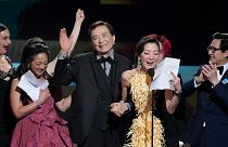 From left: Jenny Slate, Stephanie Hsu, James Hong, Michelle Yeoh, and Ke Huy Quan accept the SAG award for outstanding performance by a cast in a motion picture.
