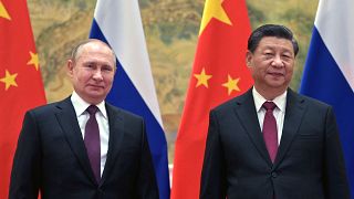 Chinese President Xi Jinping, right, and Russian President Vladimir Putin pose for a photo prior to their talks in Beijing, China, Feb. 4, 2022.