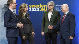 Swedish ministers standing on the podium of the energy meeting held in Stockholm