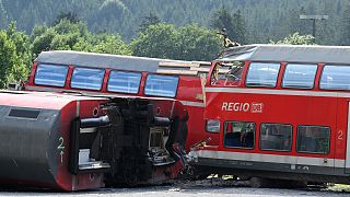 FILE: Destroyed railway carriages deposited near the site of a train accident near Burgrain, Germany June 2022