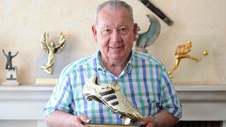 Former French planetary   shot   subordinate    Just Fontaine poses with a trophy for the 1958 shot   World Cup top-scoring record.