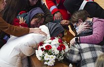 Families weep over their loved ones in Italy