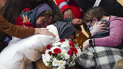 Families weep over their loved ones in Italy