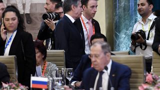 US Secretary of State Antony Blinken (top C) walks past Russian Foreign Minister Sergei Lavrov (lower) during the G20 foreign ministers' meeting in New Delhi on March 2, 2023.