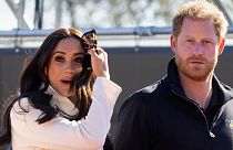 FILE - Prince Harry and Meghan Markle, Duke and Duchess of Sussex visit the track and field event at the Invictus Games in The Hague, Netherlands, Sunday, April 17, 2022. 