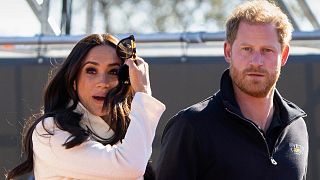FILE - Prince Harry and Meghan Markle, Duke and Duchess of Sussex visit the track and field event at the Invictus Games in The Hague, Netherlands, Sunday, April 17, 2022.