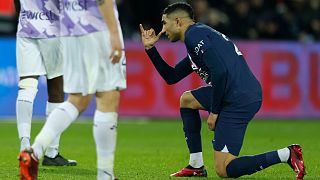 PSG's Achraf Hakimi reacts aft  scoring his broadside  archetypal  extremity   during the French League One shot    lucifer  betwixt  Paris Saint-Germain and Toulouse, successful  Paris, 4 February 2023
