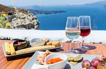 A table with Greek food and wine