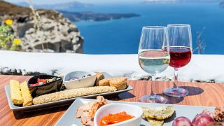 A table with Greek food and wine
