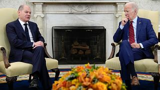 President Joe Biden listens as German Chancellor Olaf Scholz speaks during a meeting in the Oval Office of the White House in Washington.