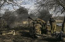 Ukrainian soldiers fire at Russian positions