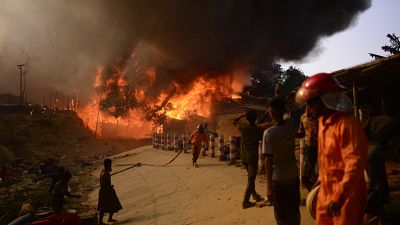 Fire personnel fight blaze at Rohingya refugee camp