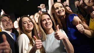 Members of the Reform Party and supporters of Prime Minister Kaja Kallas, centre, pose for photo in Tallinn, Estonia, Sunday, March 5, 2023. 