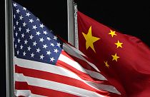 The US and Chinese flag, side by side.