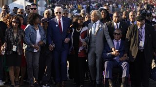 President Joe Biden prepares to walk across the Edmund Pettus Bridge in Selma, Alabama.