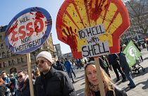 limate protesters gathered in Frankfurt and dozens of other German cities to demand tougher government action against global warming.