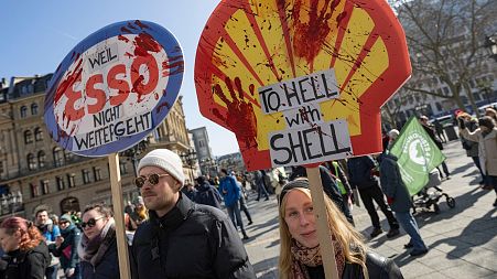 limate protesters gathered in Frankfurt and dozens of other German cities to demand tougher government action against global warming.