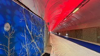 Artwork and installations line the tunnel in Bergen.