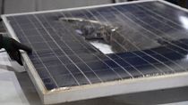A broken solar panel waiting to be recycled