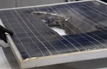 A broken solar panel waiting to be recycled