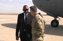Defence Secretary Lloyd Austin greeting a US military officer as he arrives to Baghdad.