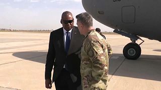 Defence Secretary Lloyd Austin greeting a US military officer as he arrives to Baghdad.