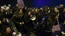 People gather during a demonstration on International Women's Day, in Pamplona, northern Spain, on 8 March, 2022