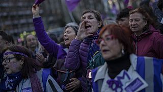Protesters attend an International Women's Day demonstration in Madrid.
