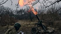Volunteer soldiers fire towards Russian positions close to Bakhmut, Donetsk region, Ukraine, Wednesday, March 8, 2023.