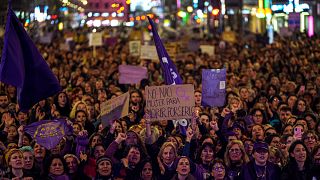 Women take part in a demonstration, on International Women's Day in Madrid, Spain, Wednesday.